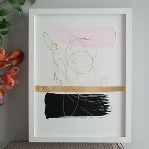Wall art in pink, black, and gold